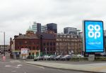 Co-op advert with Ducie Bridge in background